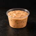 Creamy burger sauce in a 4 oz pot on a near-black background – Ben’s Fire & Feast