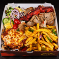 Chicken Parma on a near-black background – Ben’s Fire & Feast