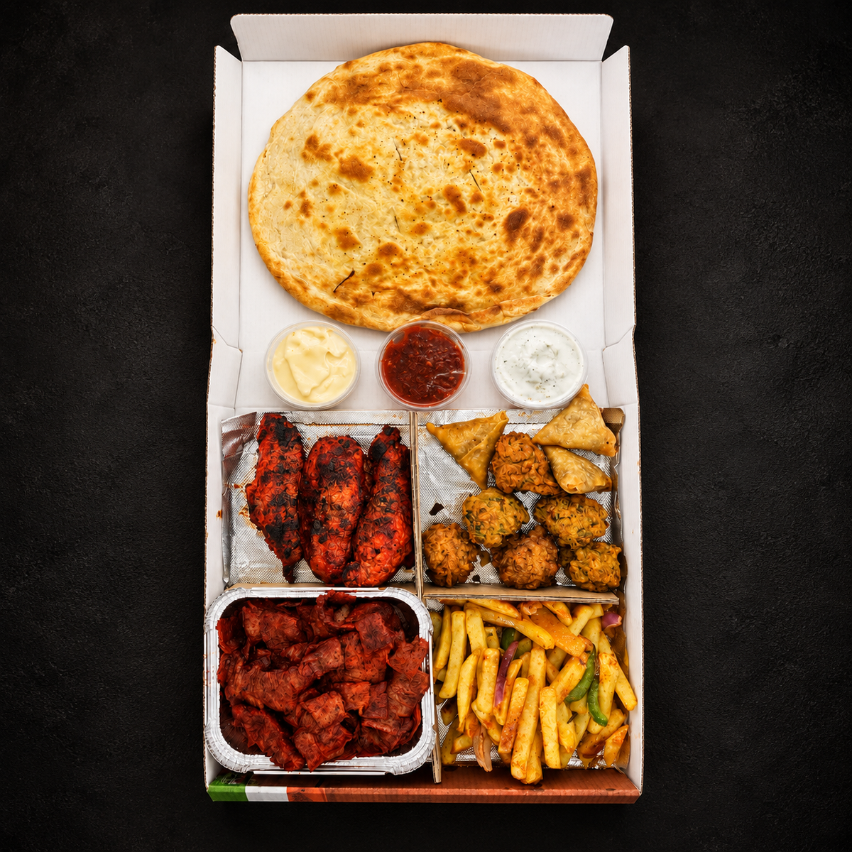 Desi Fire Feast on a near-black background – Ben’s Fire & Feast